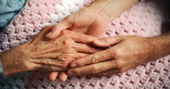 Holding Hands with Elderly Patient