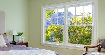 Fresh green bedroom with modern brown bed