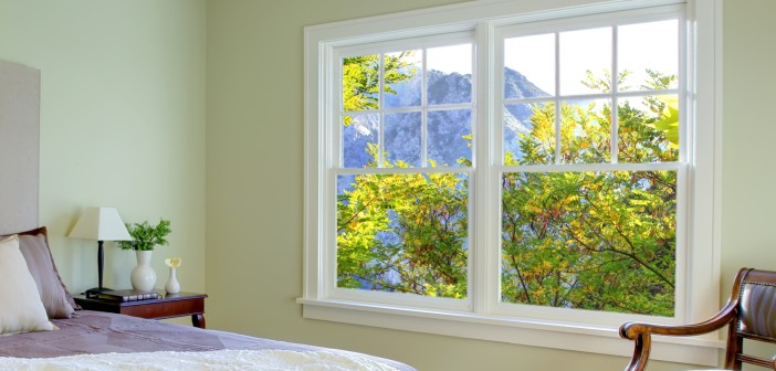 Fresh green bedroom with modern brown bed