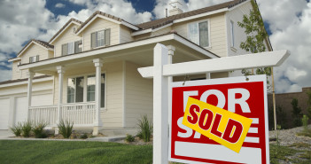 Sold Home For Sale Sign in Front of New House