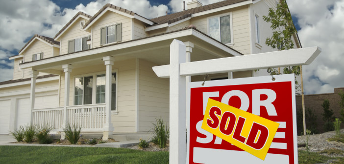 Sold Home For Sale Sign in Front of New House