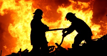 Two fire fighters and flames