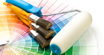 Brushes and paint-roller on a colour guide