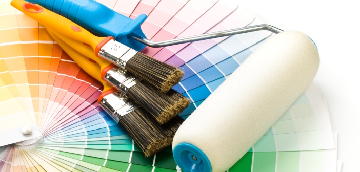 Brushes and paint-roller on a colour guide