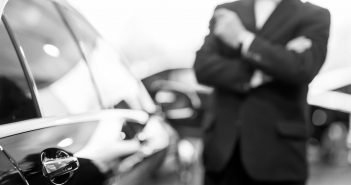 Choosing a car at dealership.