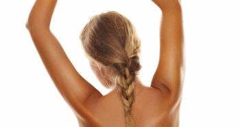 Back side view of a young, blonde woman's perfect body