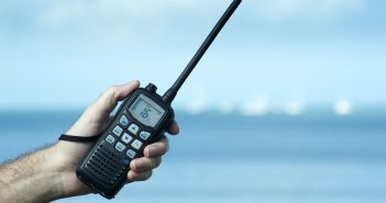 Man holding a two way radio