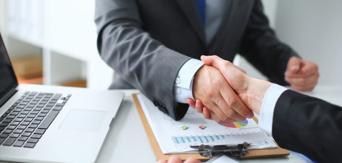 Business people shaking hands, finishing up a meeting