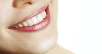 4 Anti-Aging Tricks to Having Beautiful Skin Fresh smile of woman with healthy teeth over white