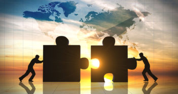 World Business teamwork puzzle pieces